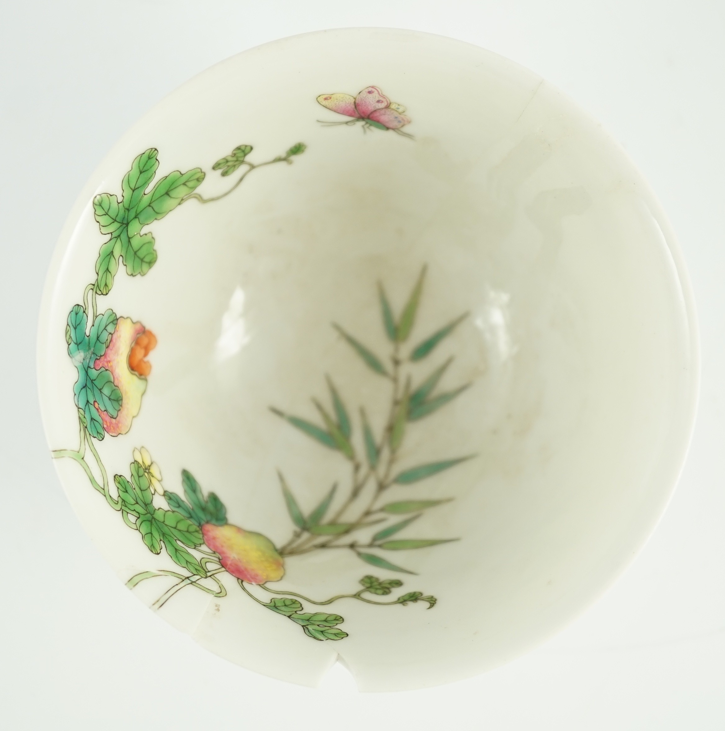 A Chinese famille rose bowl, Jiaqing seal mark and of the period (1796-1820), 10.7cm diameter, 6.3cm high, extensive damage